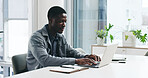 Black man, typing and office with laptop for business report, project planning or company research. Businessman, reading and review notes with computer for schedule, agenda or tasks in workplace