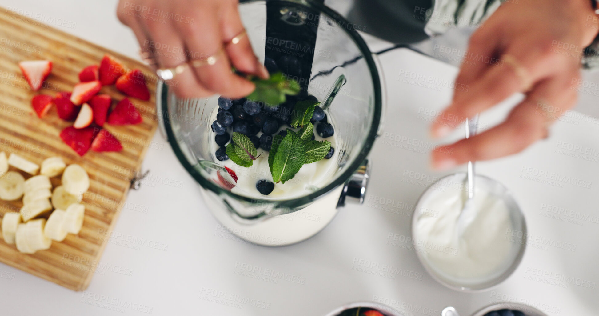 Buy stock photo Person, hands and blender with smoothie for diet, healthy drink or meal prep above in home. Top view, nutritionist or recipe mix with ingredients for natural organic beverage or milkshake in kitchen