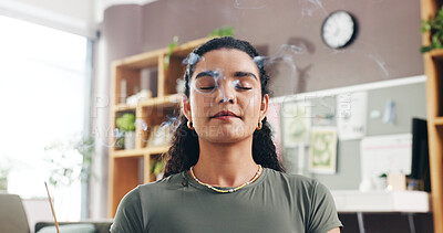 Buy stock photo Meditation, woman and burning incense for yoga, mindfulness and inner peace in home. Aroma stick, smoke and zen with person for aromatherapy, energy cleansing and balance with atmosphere to relax