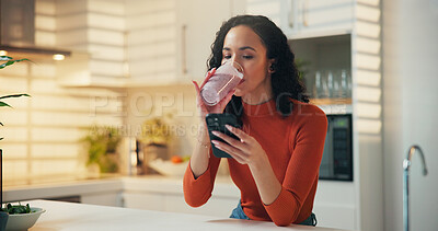 Buy stock photo Woman, phone or diet with smoothie in kitchen for health tips, nutrition or app in home. Female person, nutritionist or user with mobile smartphone for online recipe, protein shake or drink in house