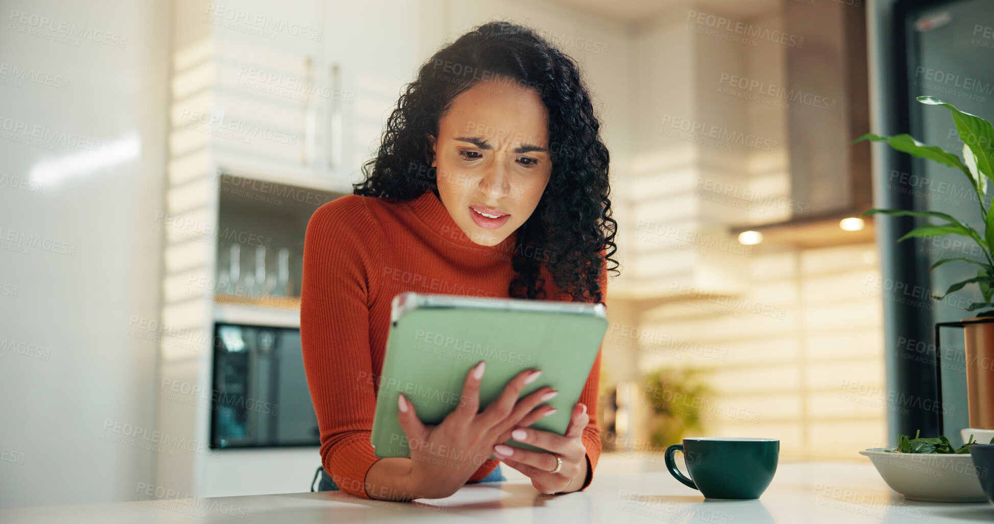 Buy stock photo Confused, coffee and tablet with woman in kitchen for reading, social media post and news feed. Network, digital subscription and email newsletter with person and tea in home for shock, app or search