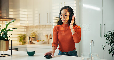 Buy stock photo Morning, happy and woman in kitchen with headphones for streaming song, audio and podcast. Home, relax and person with tech for listening to radio, music or online subscription with coffee on weekend