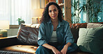 Woman, happy and relax on sofa in portrait, chilling and confidence in living room at apartment. Girl, smile and break with comfort, morning and pride with couch in lounge at house in Costa Rica