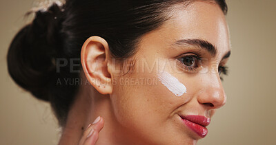 Buy stock photo Cream, beauty and smile with woman in studio for skincare, dermatology or collagen benefits. Hyaluronic acid, lotion and facial treatment with person on brown background for self care and cosmetics