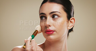 Buy stock photo Blush, makeup and brush with woman in studio for beauty, cosmetics and foundation application. Contour tools, powder and cosmetology with person on background for glow, self care and shine space