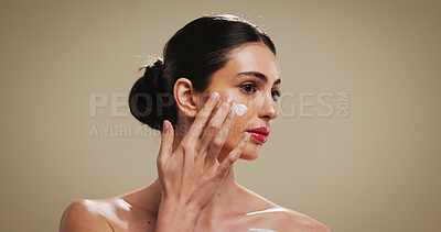 Buy stock photo Cream, beauty and cosmetics with woman in studio for skincare, dermatology or collagen benefits. Hyaluronic acid product, lotion and facial treatment with person on background for self care and space