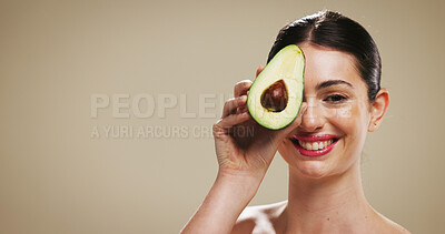Buy stock photo Portrait, woman and skincare with avocado, studio background or smile for facial treatment or beauty. Mockup space, hydration and person with fruit for smooth skin, natural cosmetics and dermatology