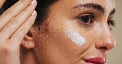 Buy stock photo Cream, beauty and glow and woman in studio for skincare, dermatology and collagen benefits. Hyaluronic acid product, lotion and facial treatment with face of person on background for self care