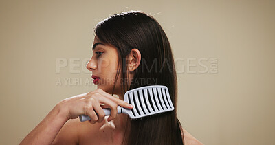 Buy stock photo Hair, brush and growth with woman in studio for salon maintenance, volume and texture. Keratin treatment, self care and scalp stimulation for beauty with person on background for shine and space