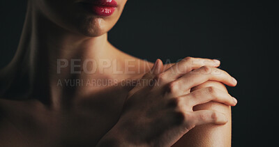 Buy stock photo Shoulder, beauty and hand of woman in studio for dermatology, body care and hygiene. Collagen benefits, aesthetic and shine with closeup of person on black background for space, grooming and touch