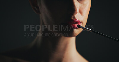 Buy stock photo Cosmetics, brush and woman in studio with lipstick, beauty or facial routine with products. Makeup, self care and female person with tool for face cosmetology treatment for glow on black background