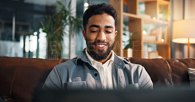 Buy stock photo Freelancer, laptop and reading with man on sofa for article research, blog writer and smile. Journalist planning, remote worker and draft editing with person in living room of home for publishing