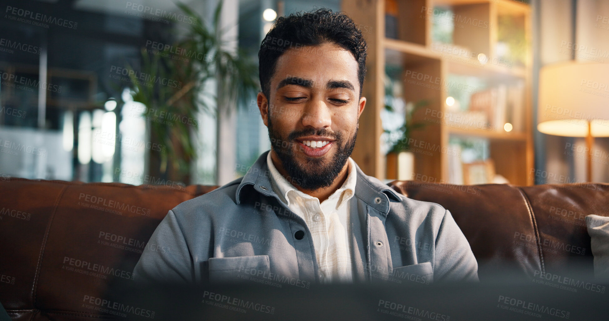 Buy stock photo Freelancer, laptop and reading with man on sofa for article research, blog writer and smile. Journalist planning, remote worker and draft editing with person in living room of home for publishing