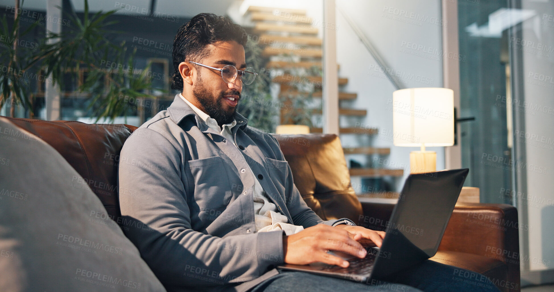 Buy stock photo Freelancer, laptop and glasses with man on sofa for article research, blog writer and reading. Journalist planning, remote worker and draft editing with person in living room of home for publishing