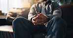 Anxiety, hands and therapy with person on sofa in office for consulting or counseling appointment. Mental health, nervous and stress with trauma patient in session for advice, healing or psychology