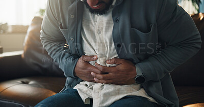 Buy stock photo Home, stomach pain and man on sofa, sick and diarrhea with indigestion, food poisoning and illness. IBS, apartment and person on couch, tummy ache and constipation with abdominal cramp and bloated