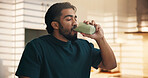 Drinking, morning and man with smoothie in kitchen for healthy diet, nutrition and wellness. Home, detox and person with protein shake, juice and beverage for vitamins, supplements and benefits