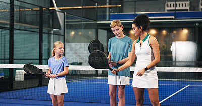Buy stock photo Padel, training and coach with kids, help and motivation with advice, teaching or technique. Sports, tennis instructor or people with practice, coordination exercise or learning with performance tips
