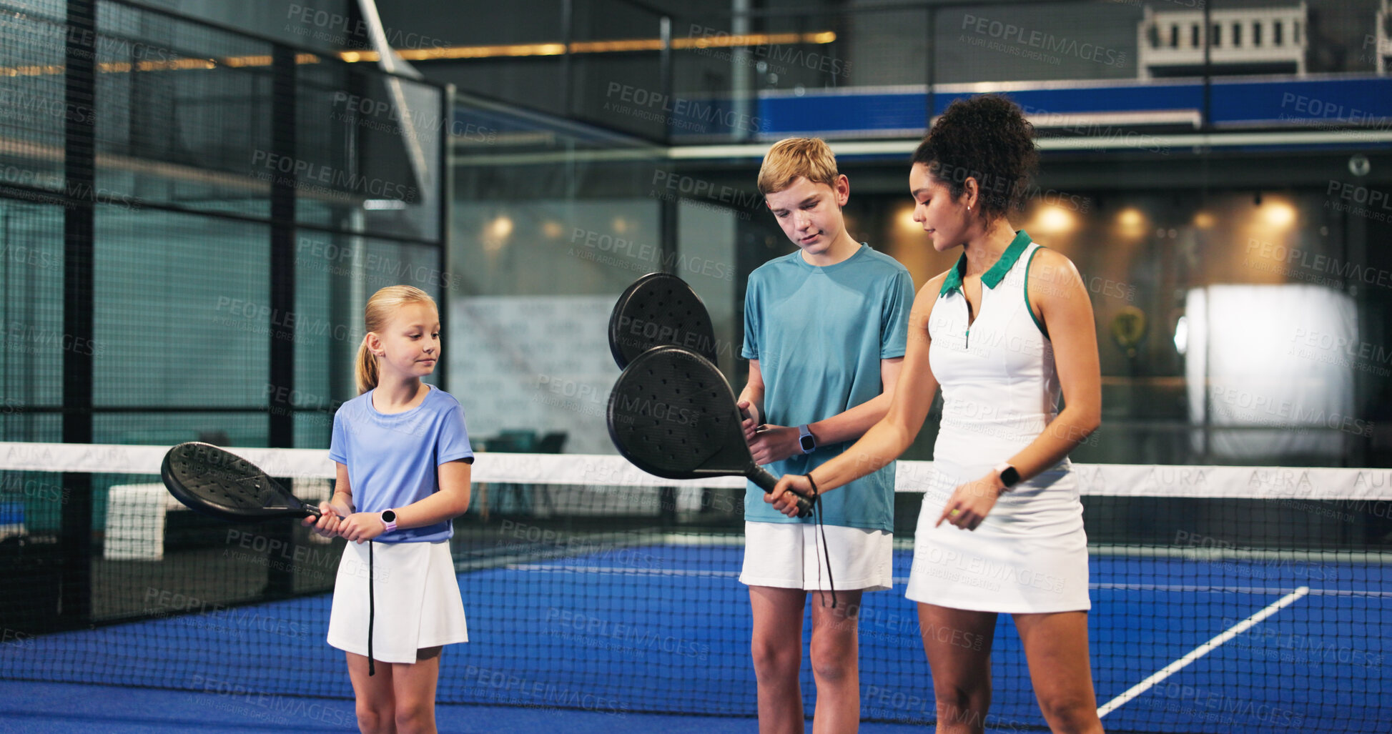 Buy stock photo Padel, training and coach with kids, help and motivation with advice, teaching or technique. Sports, tennis instructor or people with practice, coordination exercise or learning with performance tips