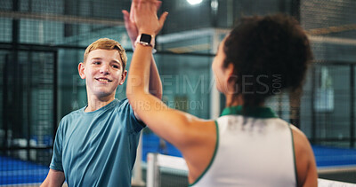 Buy stock photo Happy boy, teenager and high five with coach for padel tennis match, winning or indoor sport. Junior player, trainer and touch with smile in court for good job, well done or finish together at club