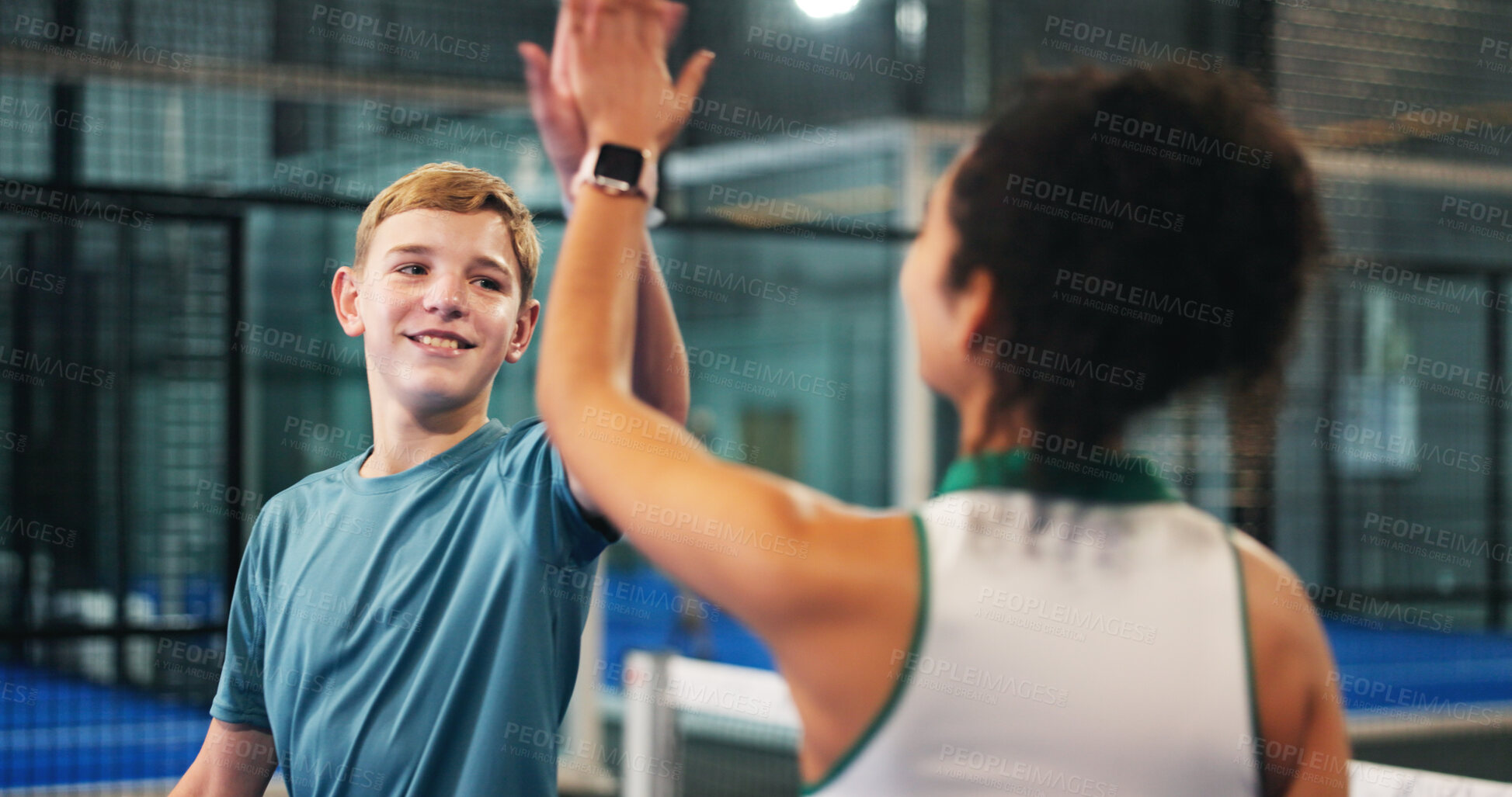 Buy stock photo Happy boy, teenager and high five with coach for padel tennis match, winning or indoor sport. Junior player, trainer and touch with smile in court for good job, well done or finish together at club