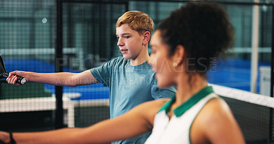 Buy stock photo Coach, padel and woman with child on court for learning sports skills, training and exercise. Personal trainer, fitness and person with children at practice for playing game, tournament and lesson
