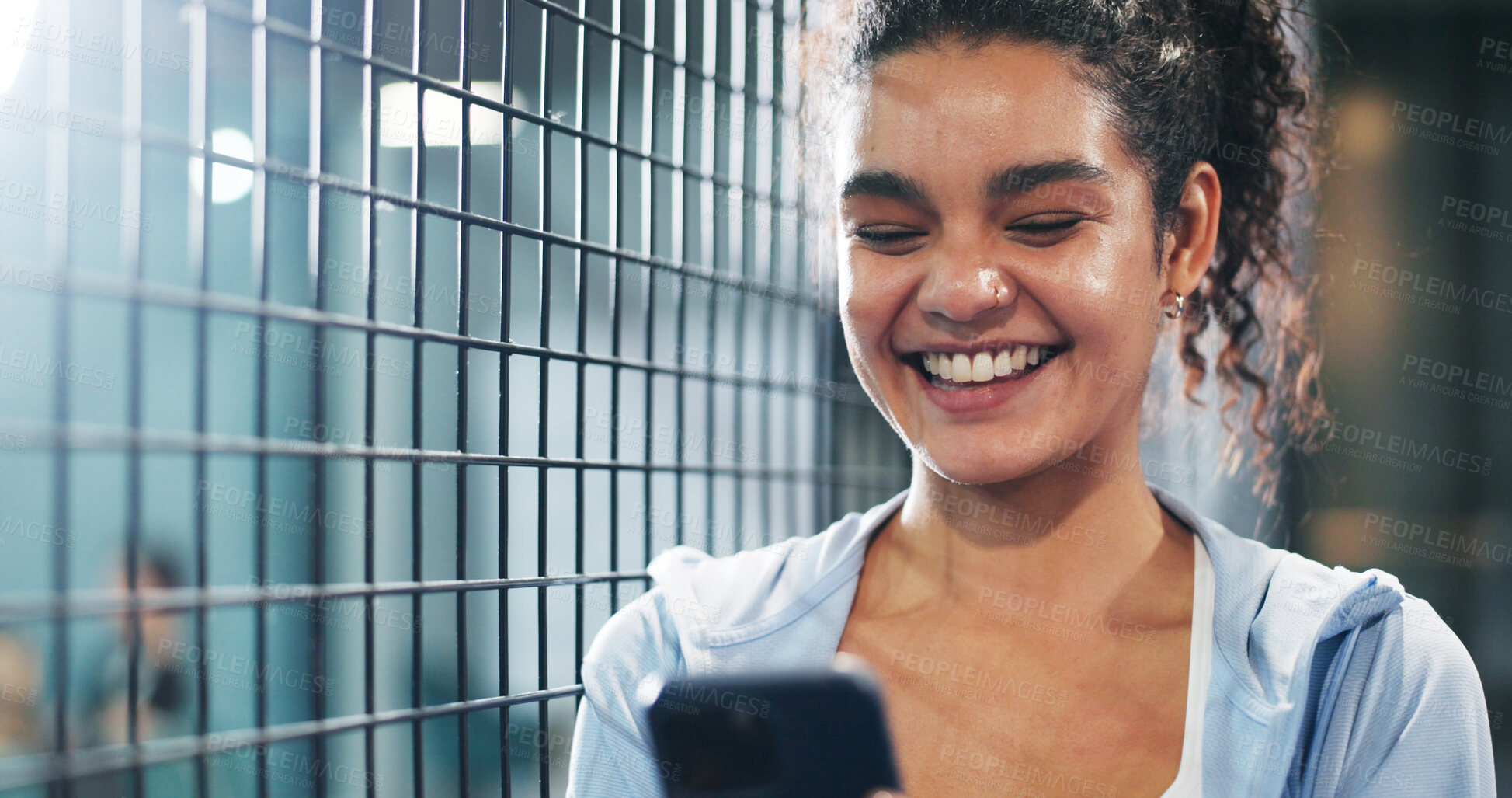 Buy stock photo Sport, woman and happy with phone at tennis court for practice break, texting and internet browsing. Athlete, night and smile with smartphone at padel club for reading notifications and social media