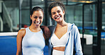 Happy, friends and portrait of women on padel court for practice, exercise and challenge. Fitness club, sports and person hug with smile for playing game, match and training together for tournament