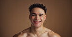 Skincare, happy and portrait of man in studio for wellness, skin hydration and dermatology. Mockup space, beauty and face of person for aesthetic, grooming and natural glow on brown background