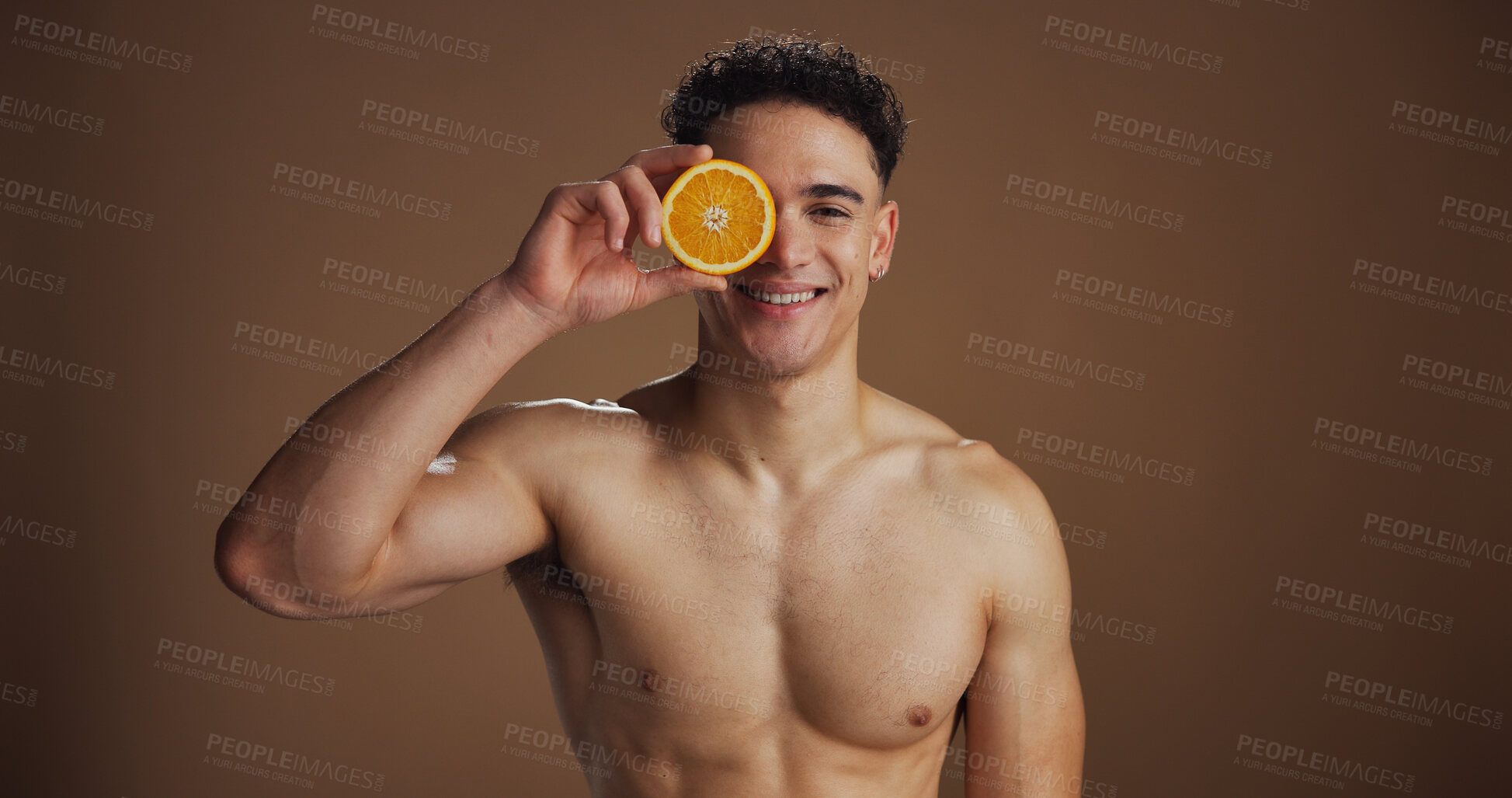 Buy stock photo Portrait, man and skincare with orange, studio background and natural cosmetics for facial treatment. Soft, glow and smooth skin with fruit, healthy or dermatology for wellness or self care in USA
