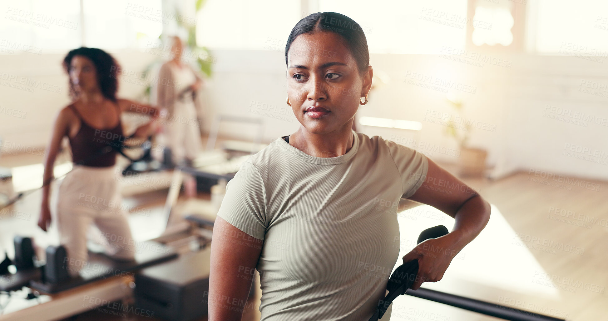 Buy stock photo Fitness, serious and woman with reformer, pilates or workout for wellness, training or coordination. Gym, people and confident for core strength, lesson and exercise for health benefits and self care