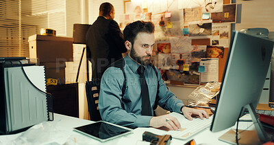 Buy stock photo Man, detective and research on computer in office for police records, evidence report or deadline. Night, colleagues and criminal database for crime investigation, case review or monitor surveillance