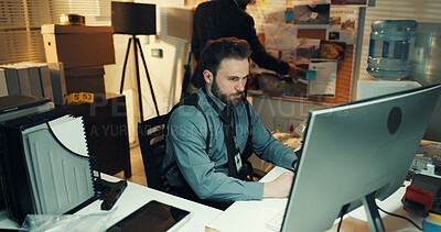 Buy stock photo Man, police and research on computer in office for criminal records, case report or problem solving. Night, detectives and tech in precinct for crime investigation, evidence analysis or trace suspect