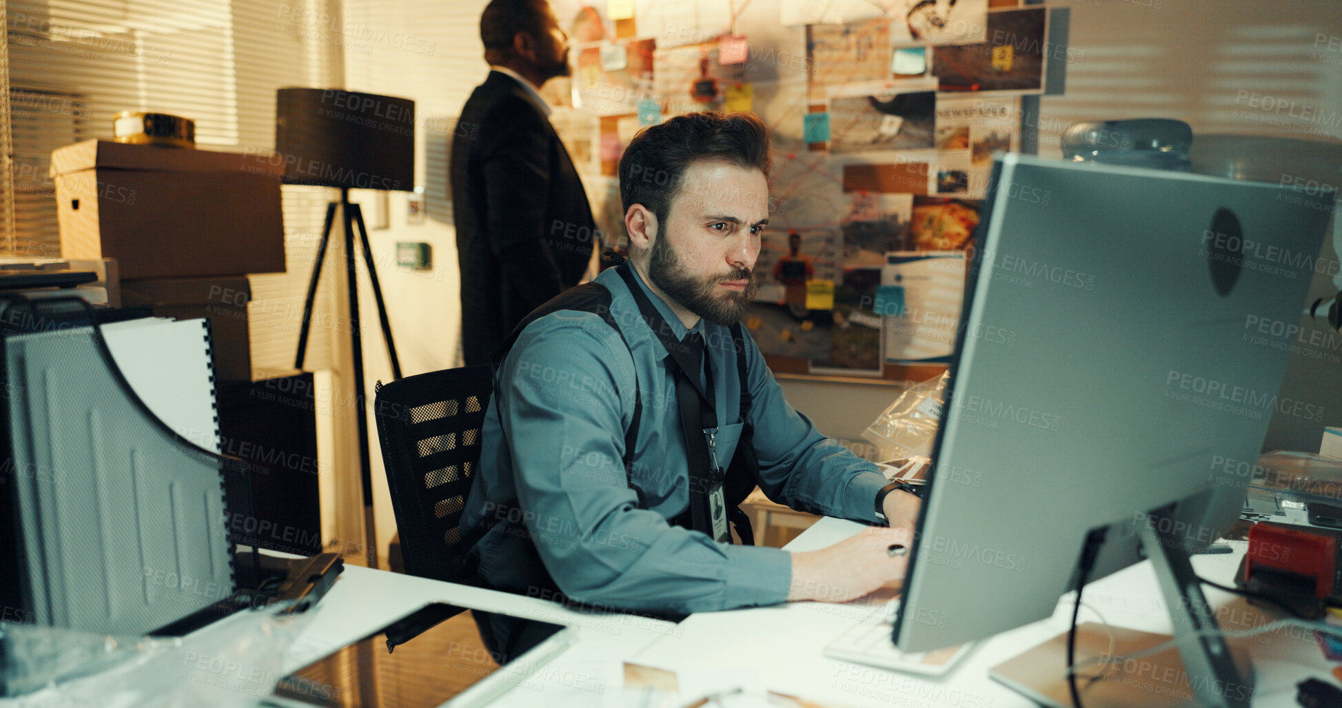 Buy stock photo Man, detective or research on computer at night for reading evidence, problem solving or case report. Investigation, colleagues and analysis of criminal database or online witness statement in office