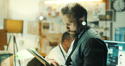 Buy stock photo Thinking, tablet and detective in office with typing for research on case with problem solving. Technology, night and male private investigator with surveillance, justice and evidence investigation