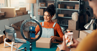 Buy stock photo Logistics, phone recording and ring light with woman in studio for advertising or product review. Boxes, supply chain and video with people in workshop for delivery, dropshipping or ecommerce