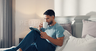 Buy stock photo Drinking, coffee and man with tablet, bedroom or proofreading fiction story, website or remote work. Ghostwriter, tea and person with tech for novel, freelance and editing ebook on bed in house