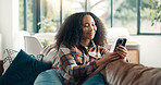 Happy, woman and relax with phone on sofa for social media browsing, reading ebook or online news. Weekend, person and smartphone in home for app download, streaming service and scrolling dating site