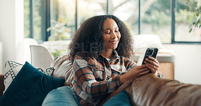 Buy stock photo Happy, woman and relax with phone on sofa for social media browsing, reading ebook or online news. Weekend, person and smartphone in home for app download, streaming service and scrolling dating site