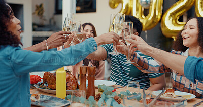 Buy stock photo New Year, celebration and people with dinner, cheers and friends together for gathering and bonding. Happy, reunion and group with alcohol for toast, supper and balloon decoration on holiday at house