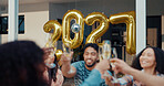 New Year, reunion and people at party, cheers or friends together for celebration or festive season. House, gathering and group with alcohol to welcome 2027, toast and balloon decoration on holiday