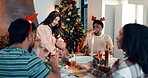 Woman, serving and food to friends for Christmas celebration, healthy meal and social gathering. Happy, people and dishing turkey of festive cuisine, holiday reunion and eating lunch together in home