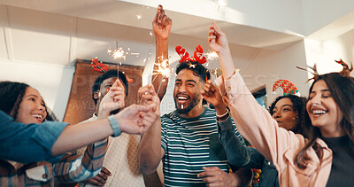 Buy stock photo Happy people, friends and celebration with fireworks for festive party, new year or christmas. Excited, group or community with smile or sparklers for reunion, bonding or get together in house
