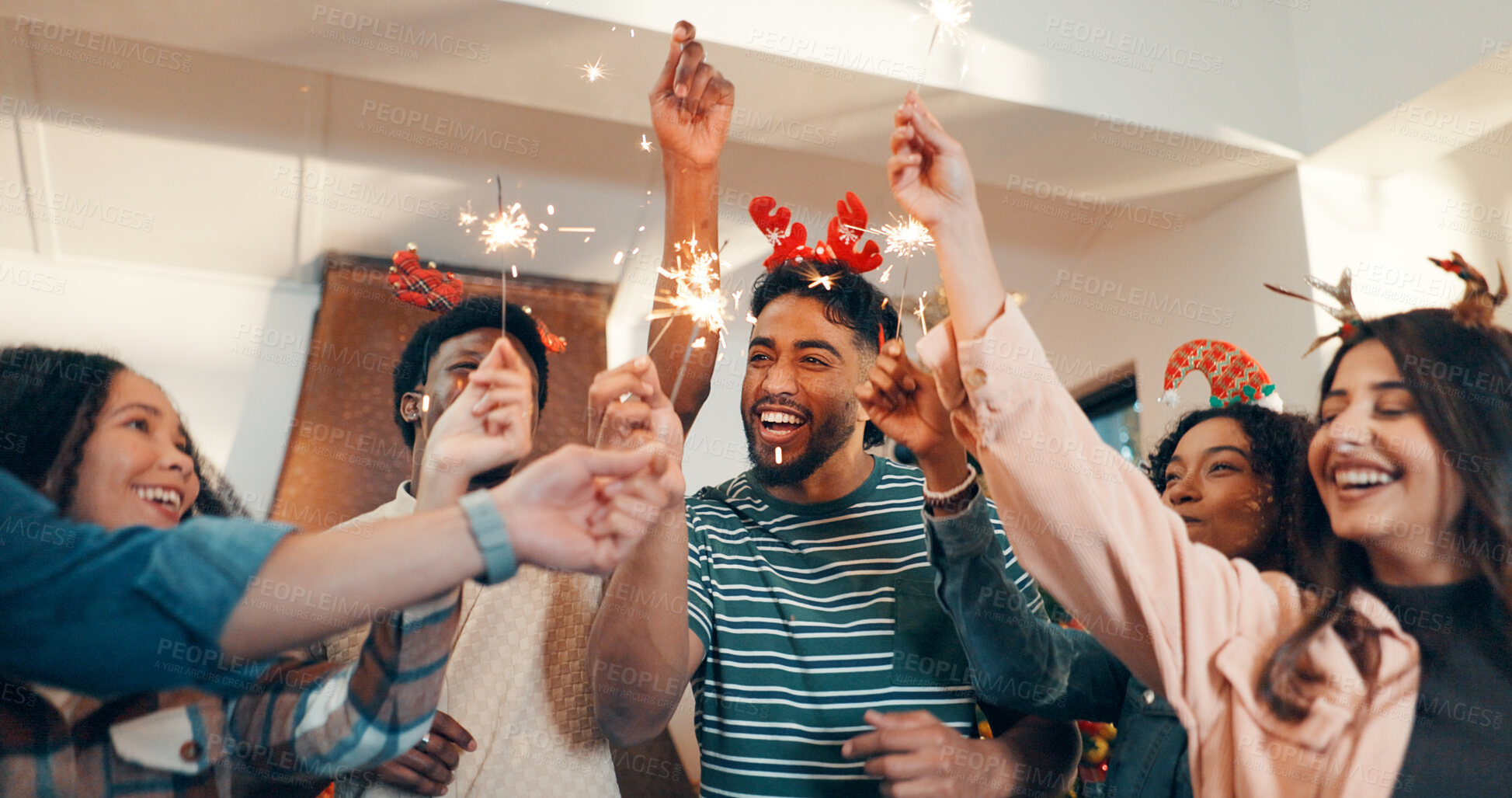 Buy stock photo Happy people, friends and celebration with fireworks for festive party, new year or christmas. Excited, group or community with smile or sparklers for reunion, bonding or get together in house