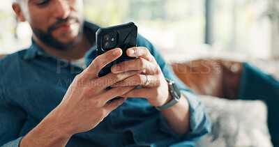 Buy stock photo Man, hands and typing with phone for sofa, scroll social media and reading notification in home. Cellphone user, connection and search website, download digital app or mobile ebook in living room