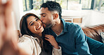 Selfie, kissing and couple on couch, smile and bonding together with happiness, photo and marriage. Home, profile picture and man with woman, love and relax with relationship, romantic and memory