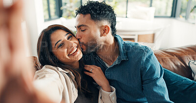 Buy stock photo Selfie, kissing and couple on couch, smile and bonding together with happiness, photo and marriage. Home, profile picture and man with woman, love and relax with relationship, romantic and memory POV