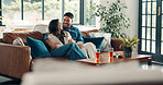 Hug, relax and smile with couple on sofa in living room of home together for bonding or connection. Love, wellness and weekend with happy people embracing in apartment for commitment or relationship