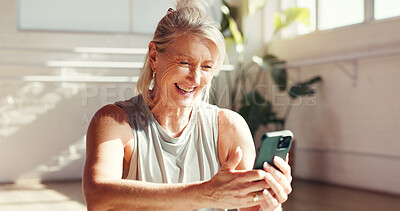 Buy stock photo Phone, laugh and old woman in gym for fitness, exercise schedule or information online for health. Mobile, studio and happy senior person check wellness app for pilates, funny meme and reading joke