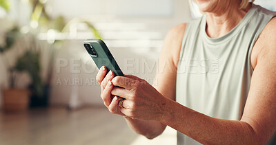 Buy stock photo Yoga, hands and woman with phone in home for social media, online health app and workout progress. Morning, pilates and mature person on smartphone for internet, typing message and exercise website